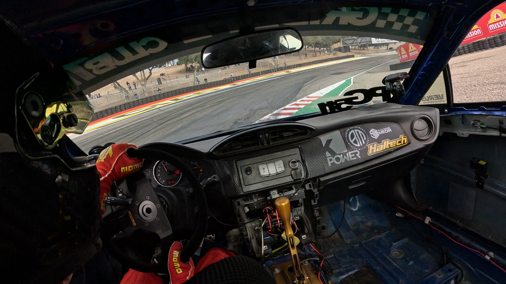Raw in-car GoPro frame entering the Corkscrew at Laguna Seca