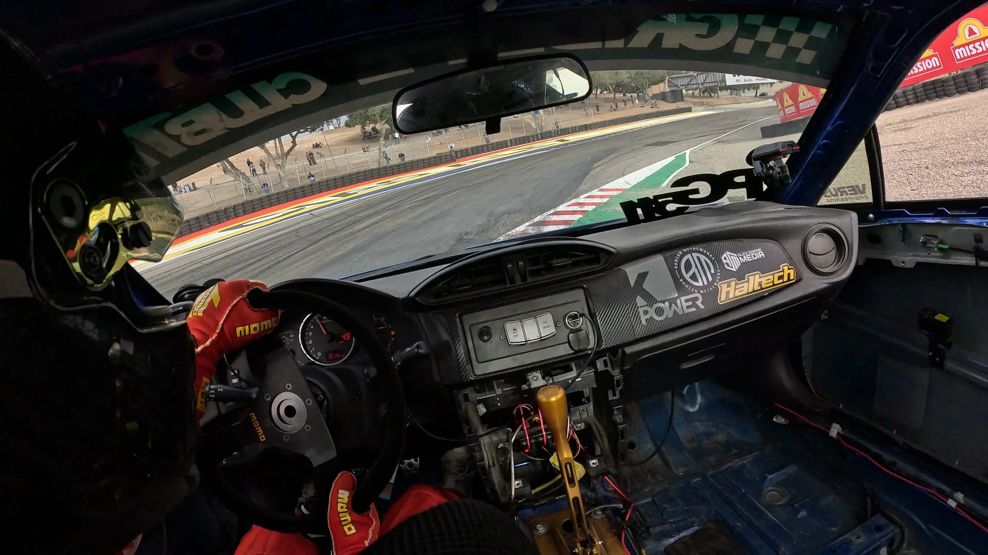 Raw in-car GoPro frame entering the Corkscrew at Laguna Seca